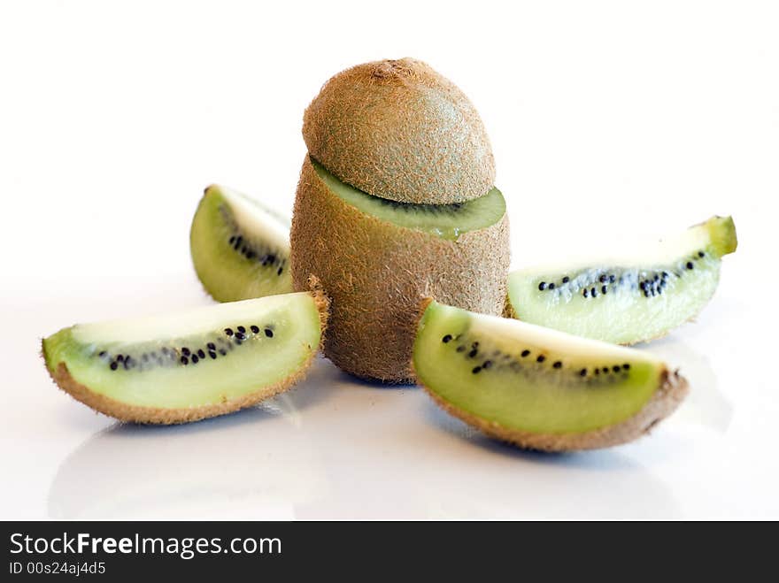 Kiwi fruit spliced and whole on white background isolated. Kiwi fruit spliced and whole on white background isolated