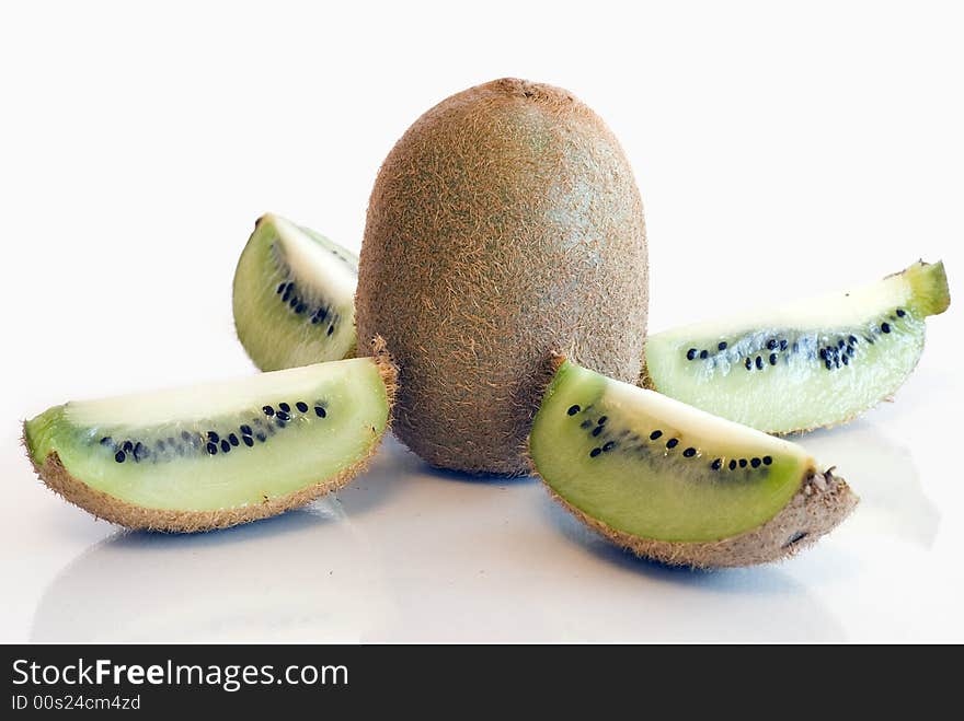 Kiwi fruit spliced and whole on white background isolated. Kiwi fruit spliced and whole on white background isolated