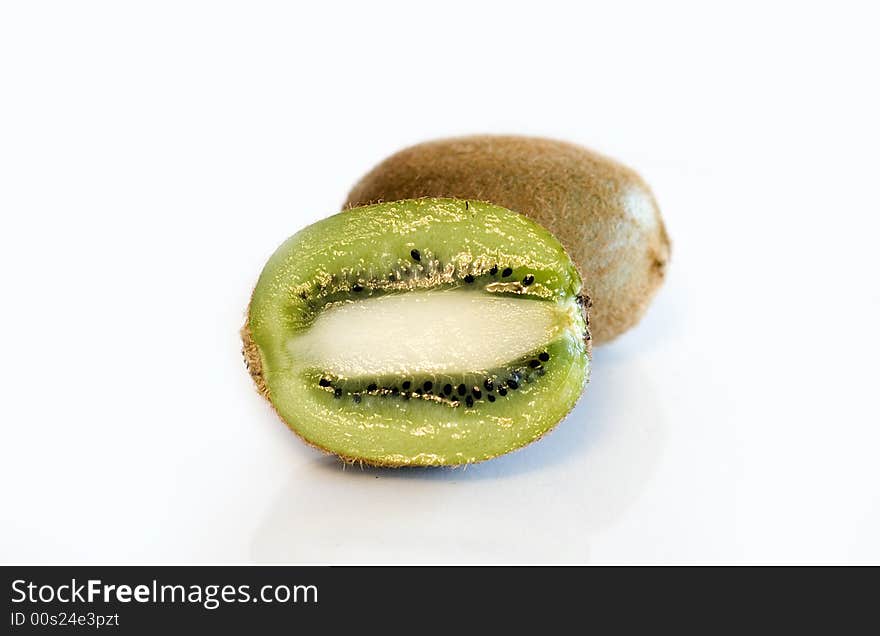 Colorful kiwi fruit whole and cut by four pieces