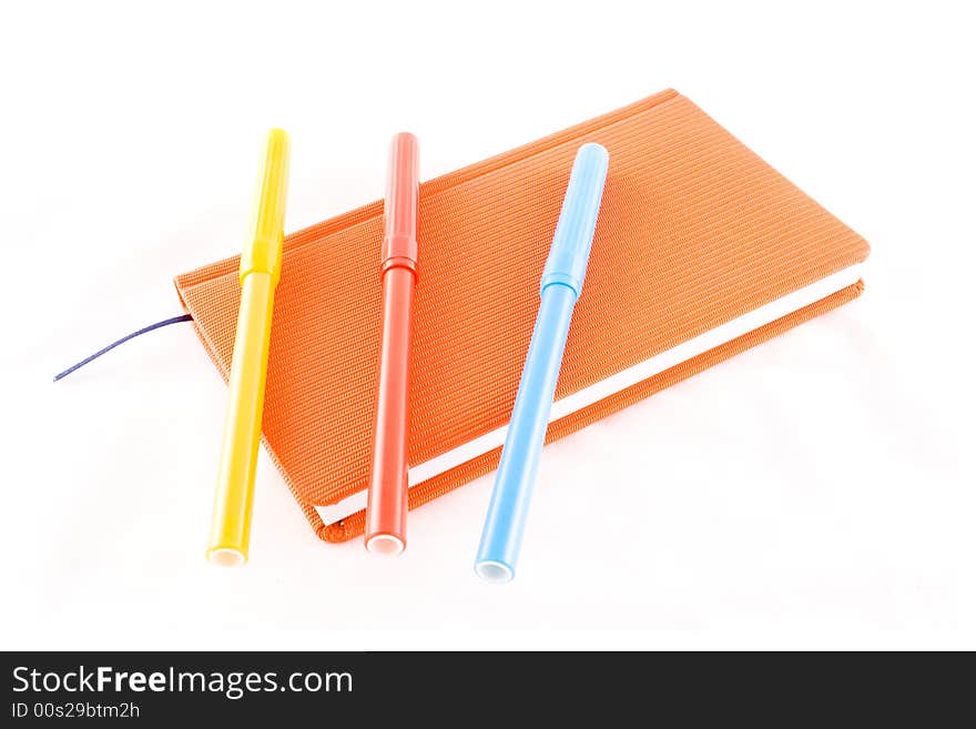 Red calendar and markers on a white background. Red calendar and markers on a white background