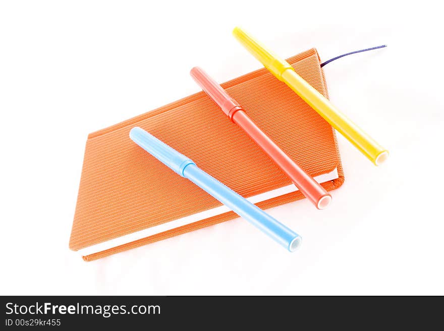 Red calendar and markers on a white background. Red calendar and markers on a white background