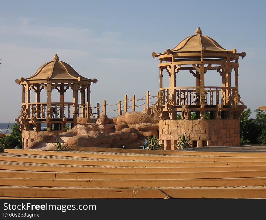 Brown oriental towers from red sea, in daylight