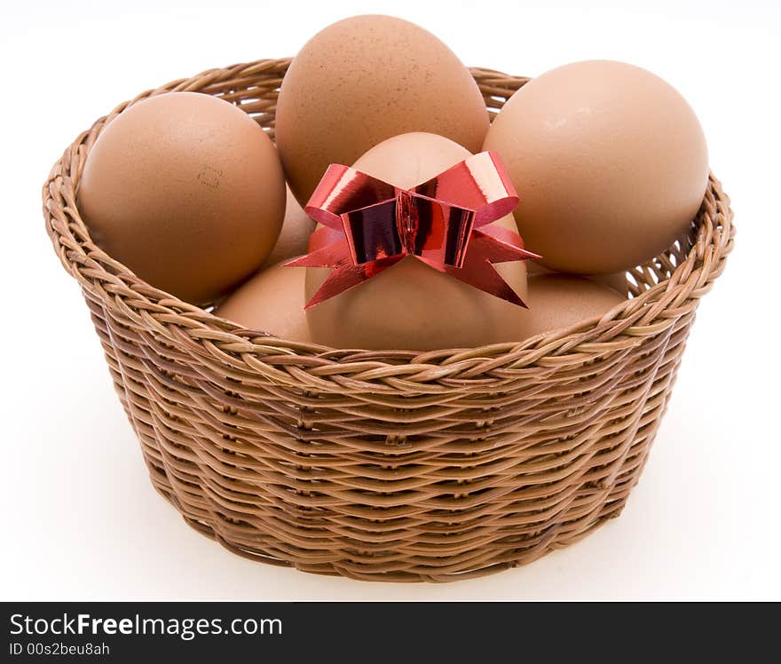 Easter Eggs in Basket on White Background