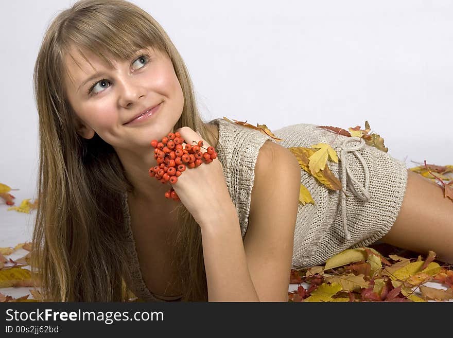 A beautiful young autumn leaves girl