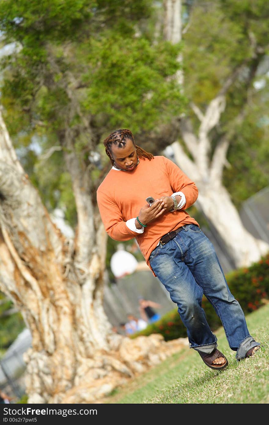 Man Outside Dialing Cell Phone