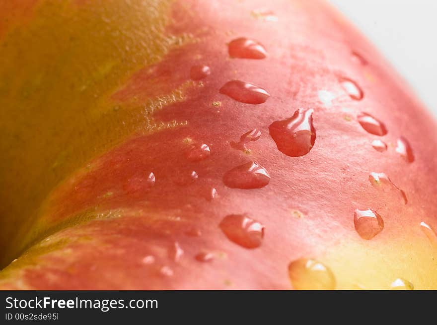 Part of a fresh wet apple on white background