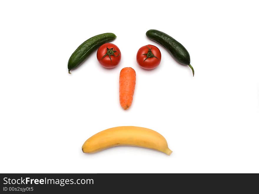 Face made with vegetables on the white background. Face made with vegetables on the white background