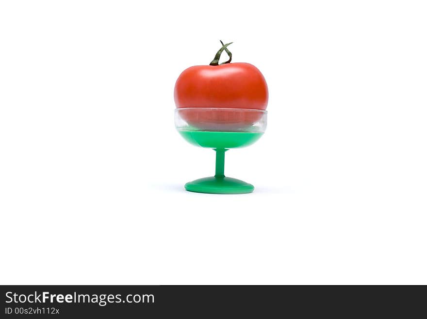 Juicy Isolated Tomato On A Green Suppot