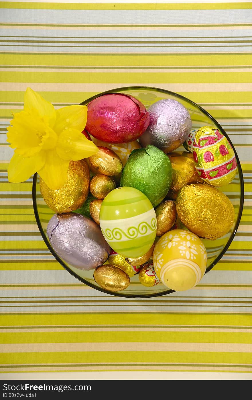 Easter eggs and flower in bowl.