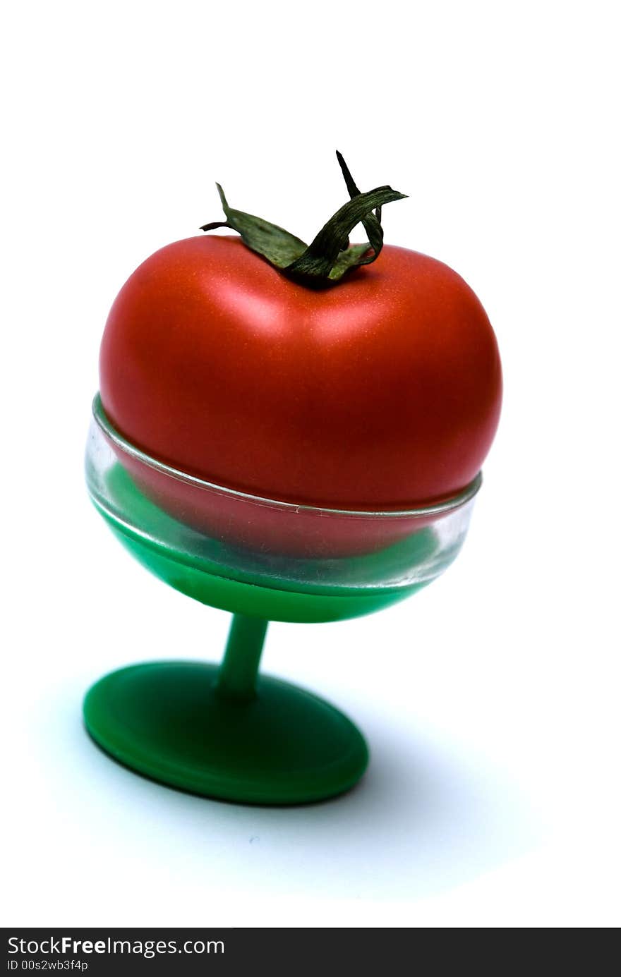 Juicy Isolated Tomato on a green suppot