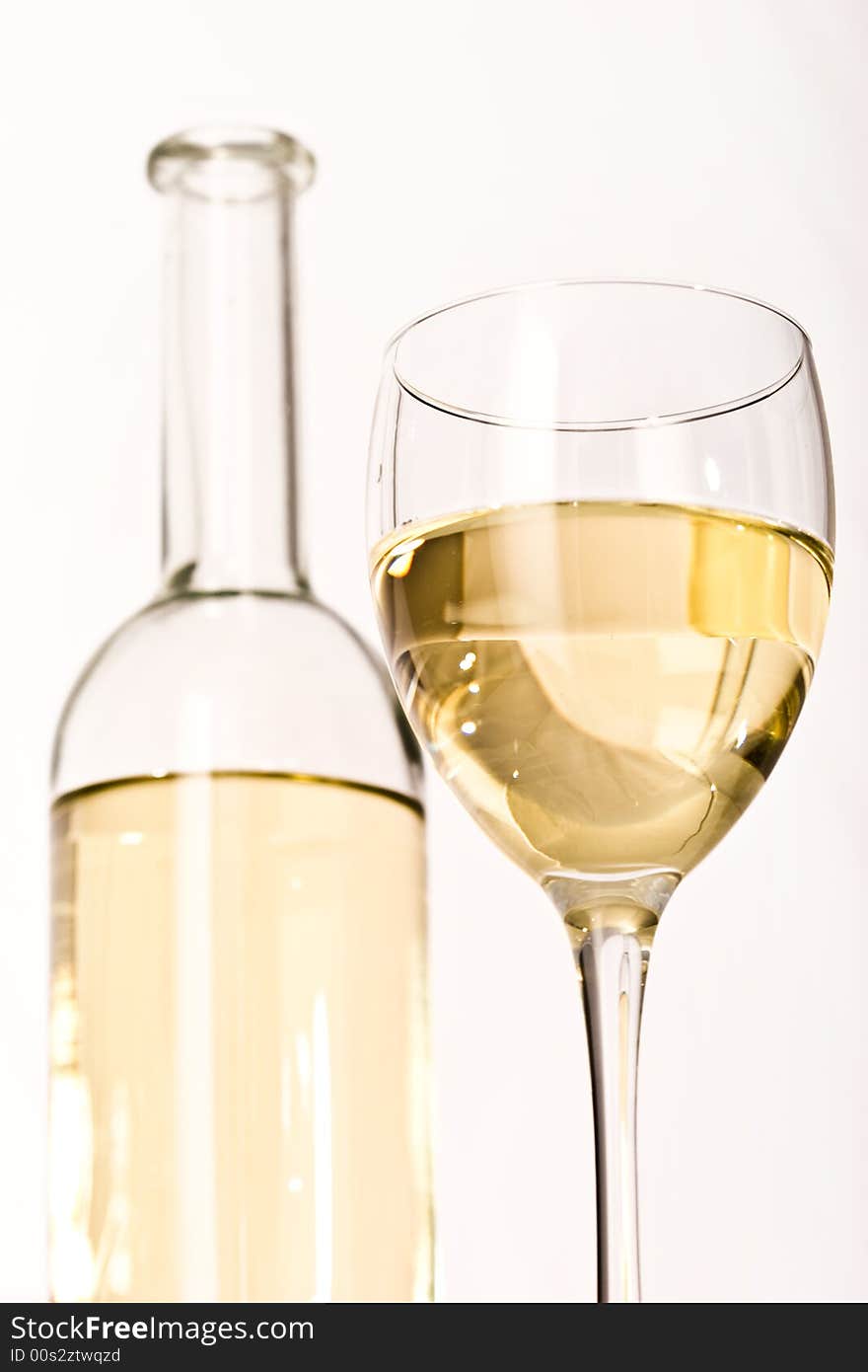 Drink series: white wine glass and bottle over white