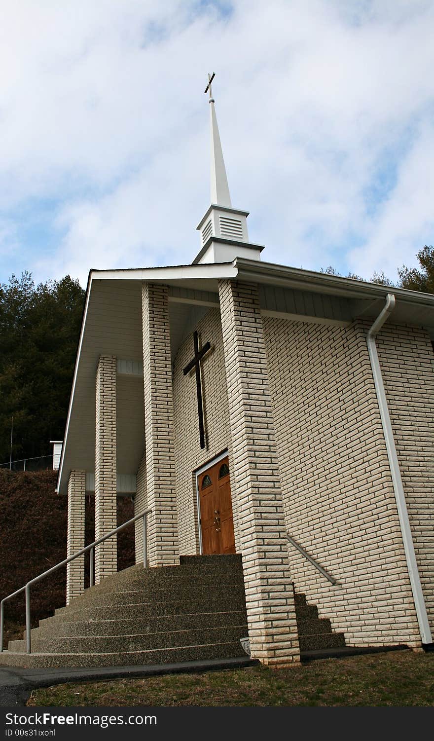 Beautiful and unique front entry to a white brick church. Beautiful and unique front entry to a white brick church.