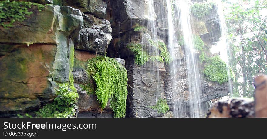 Waterfall Cascading Over Wet Rocks