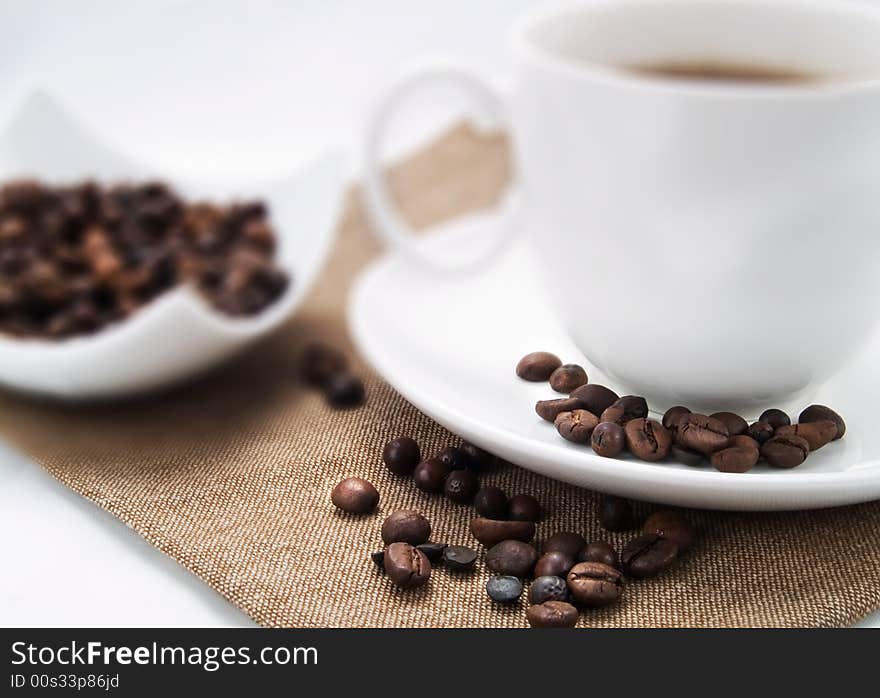 Coffee beans on a coffee cup