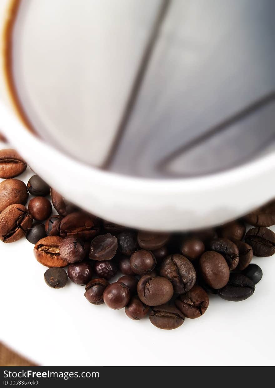 Coffee beans on a coffee cup