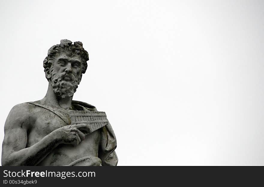 Statue of figure with pan pipes isolated