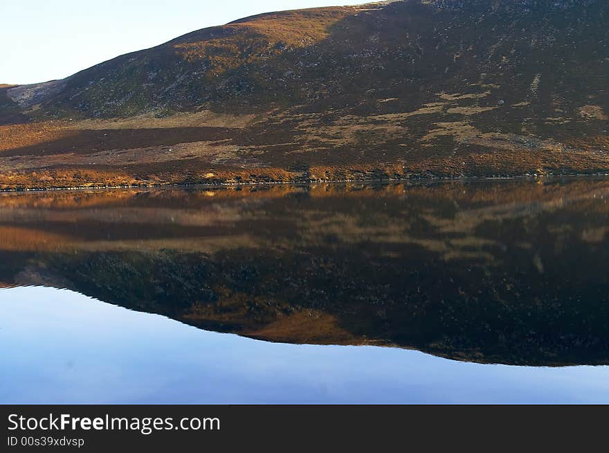 Reflection of the hills in the water of loch lee