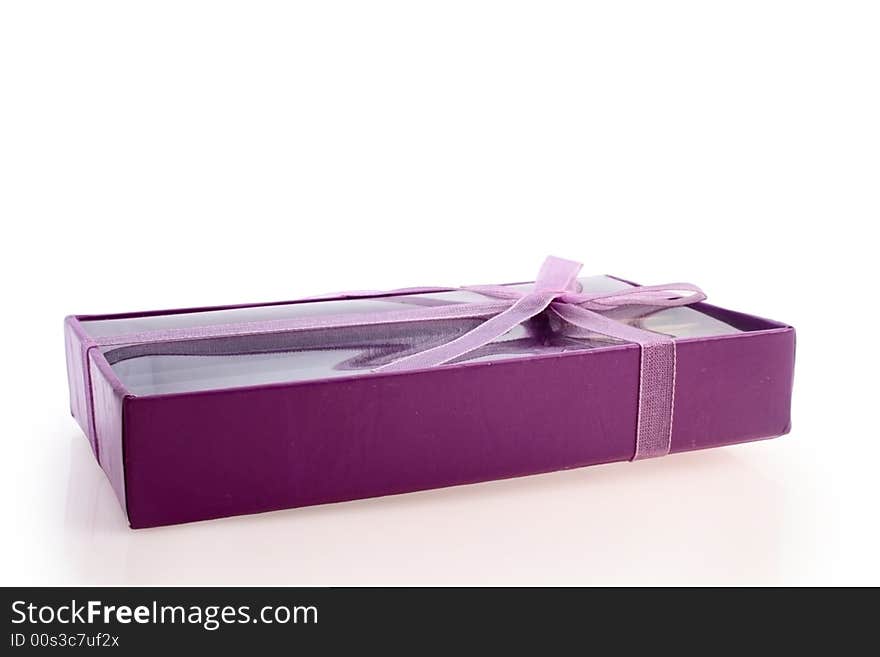 Small violet box with gift isolated on white. Small violet box with gift isolated on white