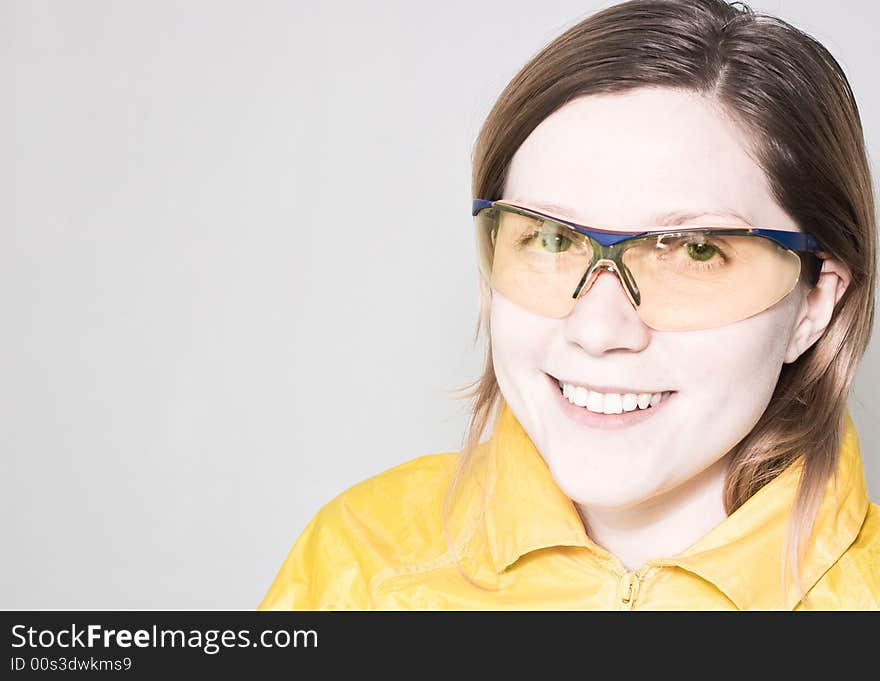 Woman in workwear and protective glasses