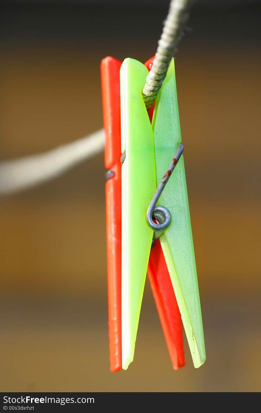 Two clothespins, green & red.line