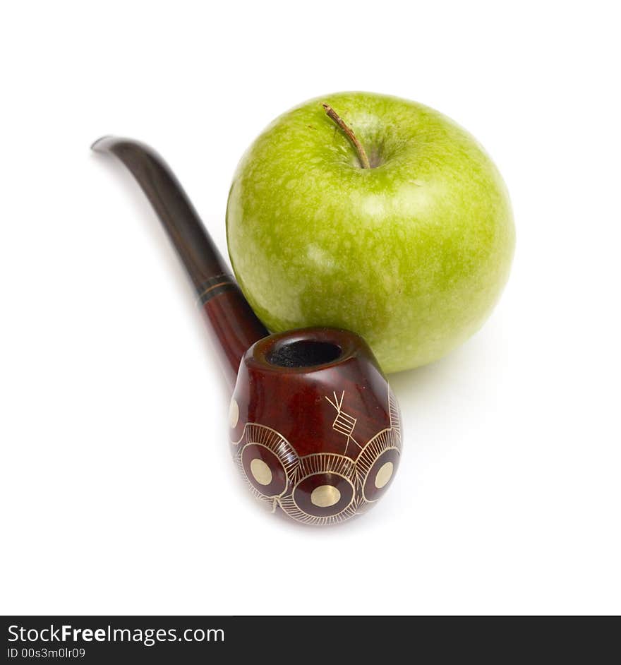 Long ornamented north-caucasian pipe with big green apple at white background. Long ornamented north-caucasian pipe with big green apple at white background