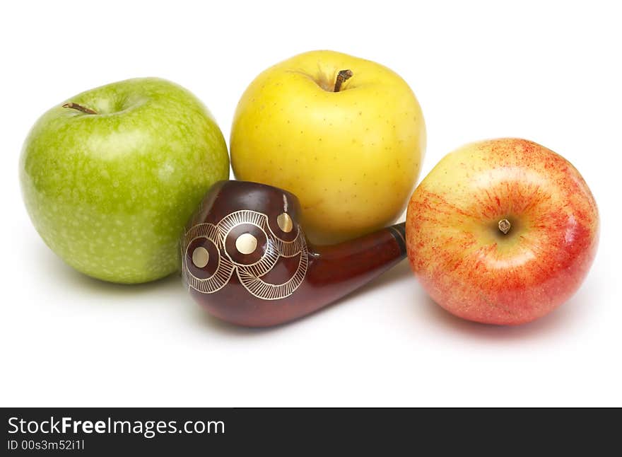 Long ornamented north-caucasian pipe with multicolored apples at white background. Long ornamented north-caucasian pipe with multicolored apples at white background