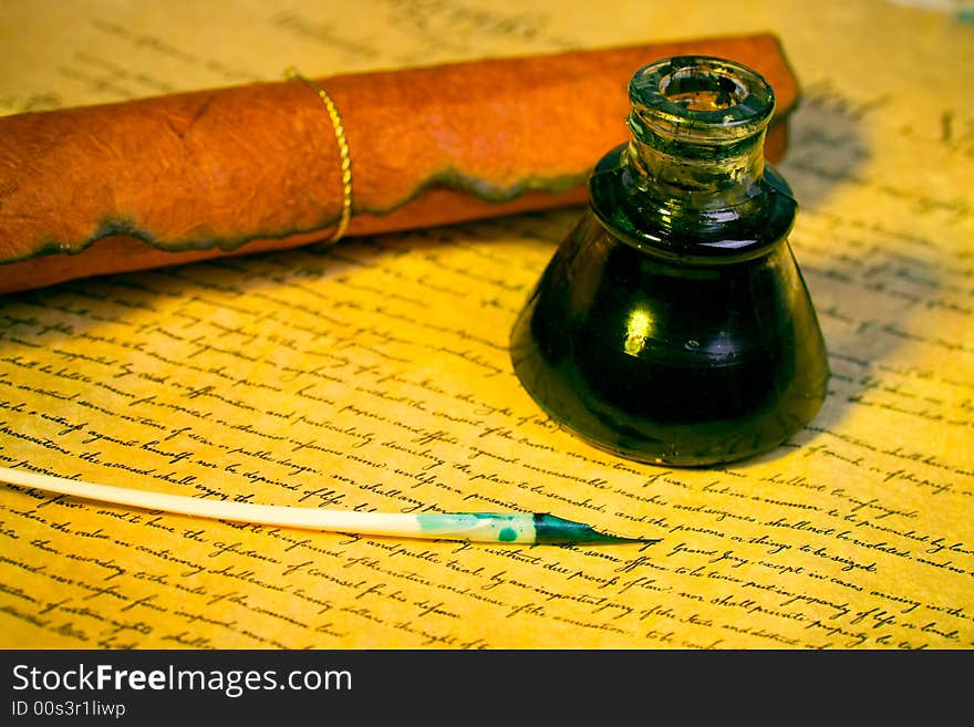 Feather , inkwell and paper with an antique look