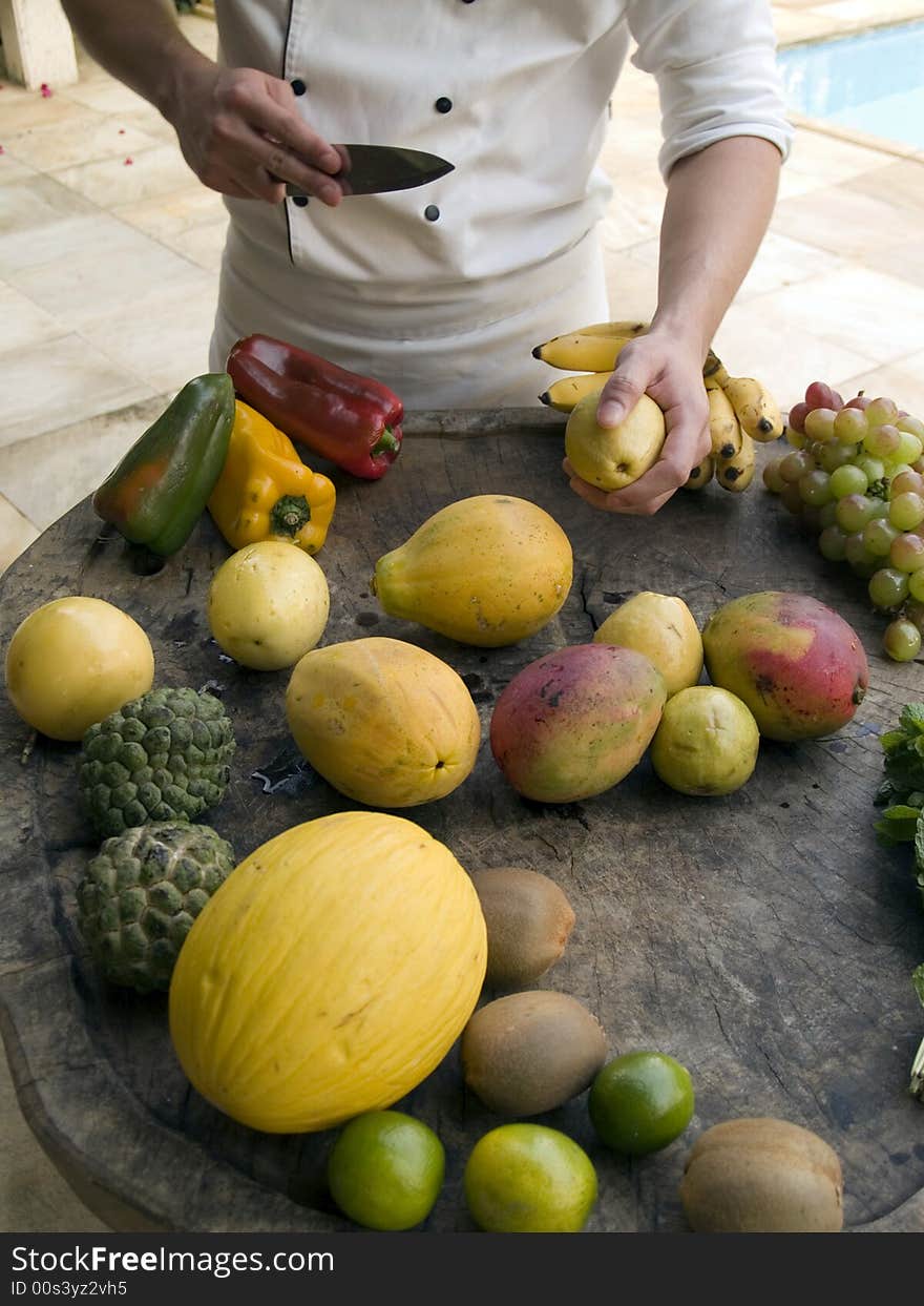 Chef about to cut fruits. Chef about to cut fruits