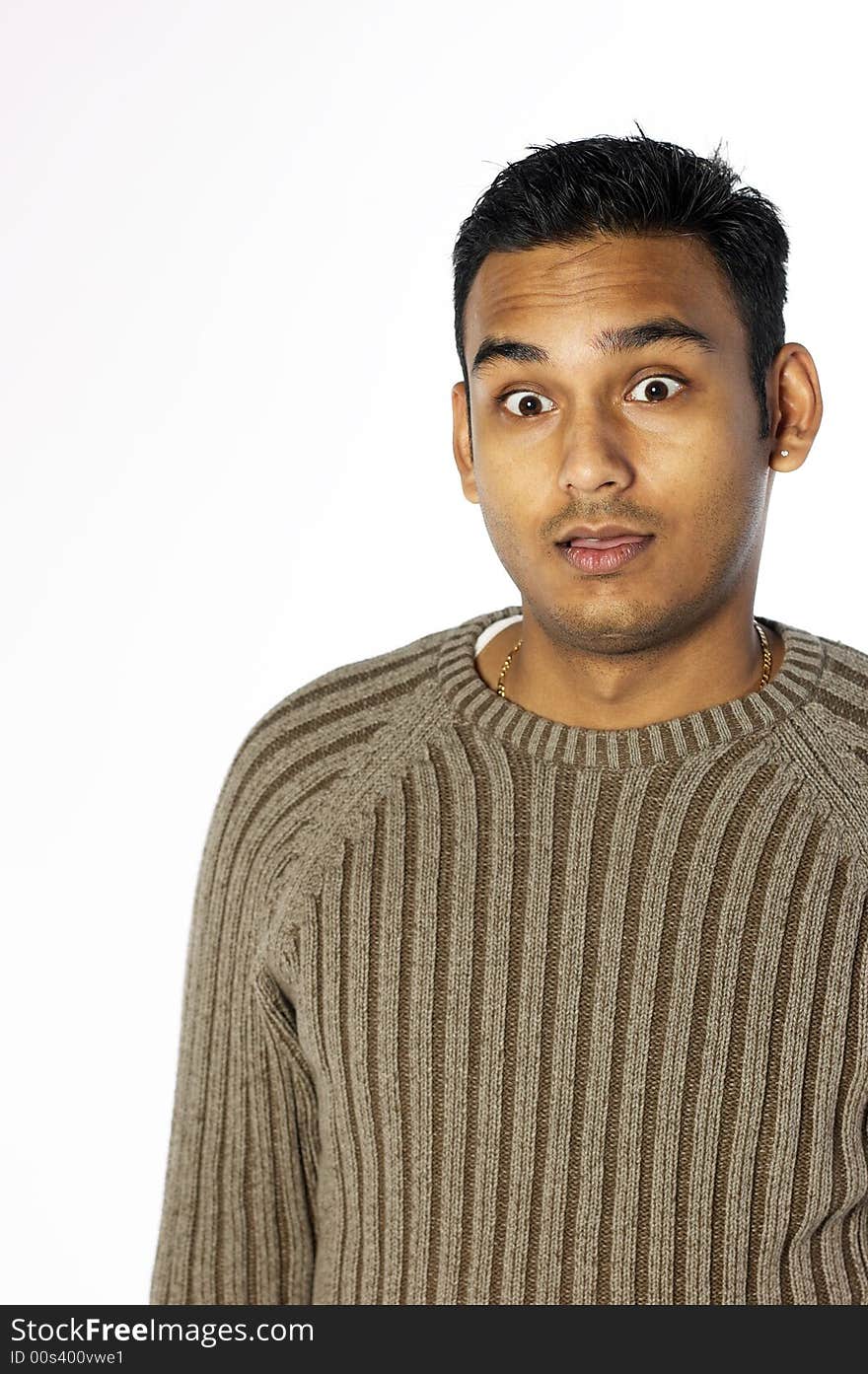 Surprised young indian man in sweater. Surprised young indian man in sweater
