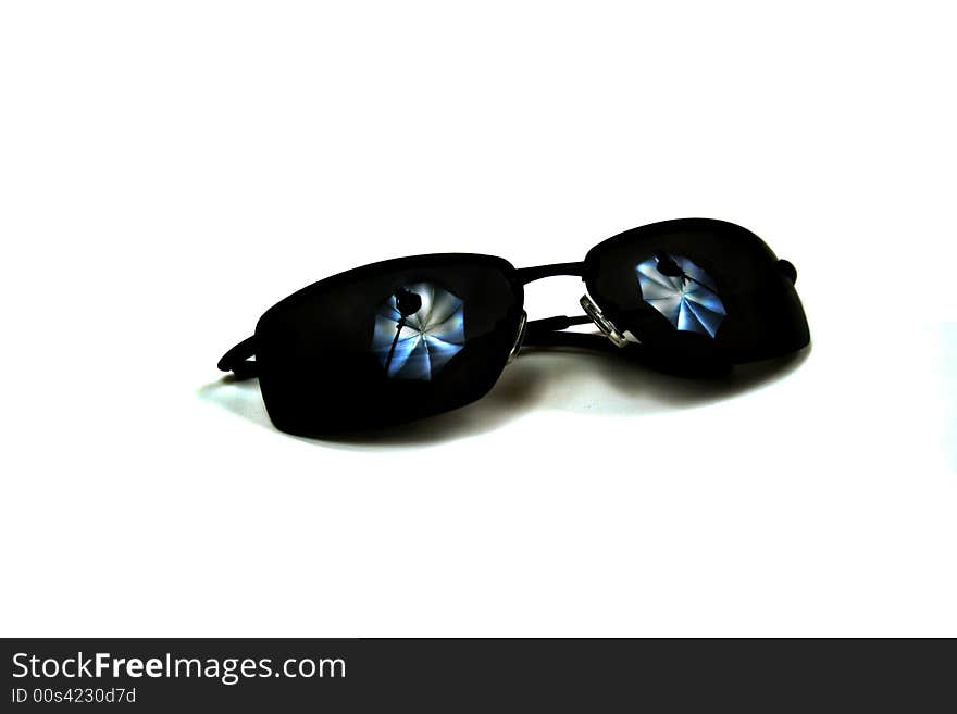 Sunglasses with Studio Lighting was created to  show a photographer's studio lights reflection in the lenses of the sunglasses when adjusted to the proper orientation. This is an abstract representation.