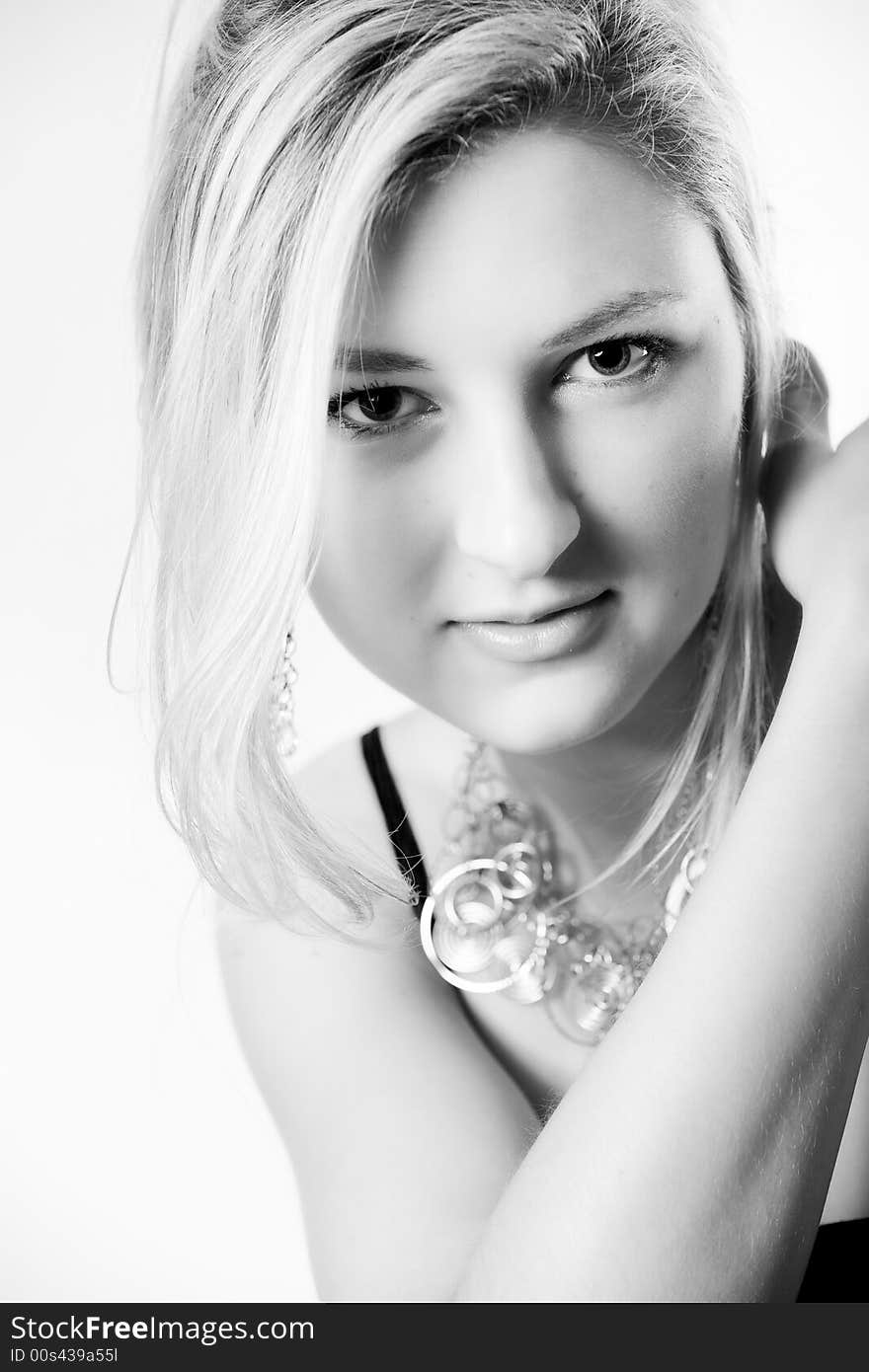 Young girl in a dress in the studio on a white background. Young girl in a dress in the studio on a white background