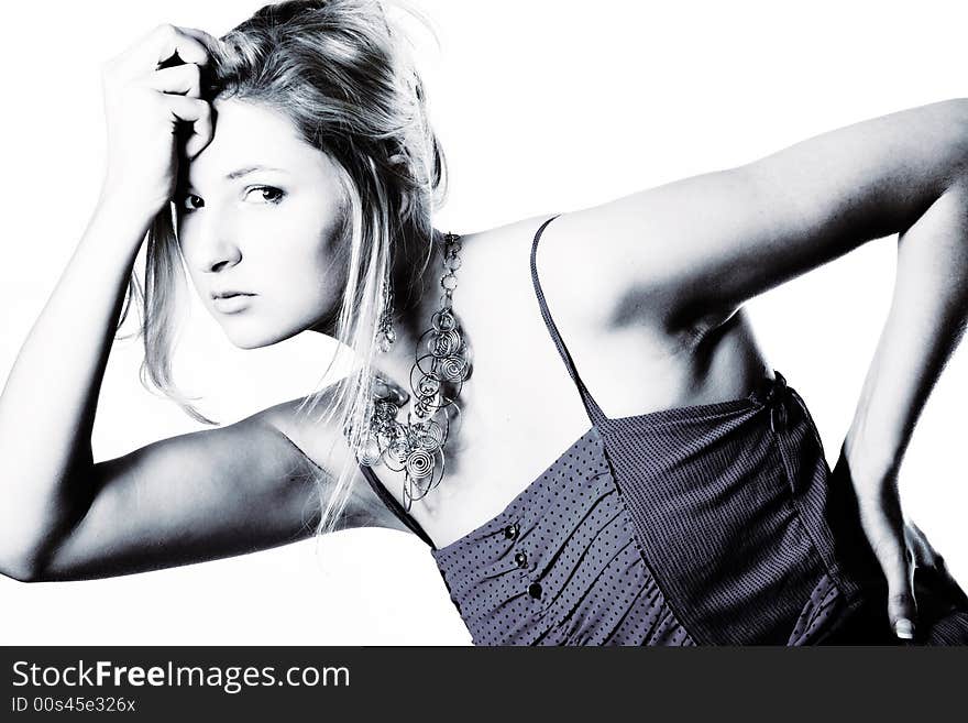 Young girl in a dress in the studio on a white background. Young girl in a dress in the studio on a white background.