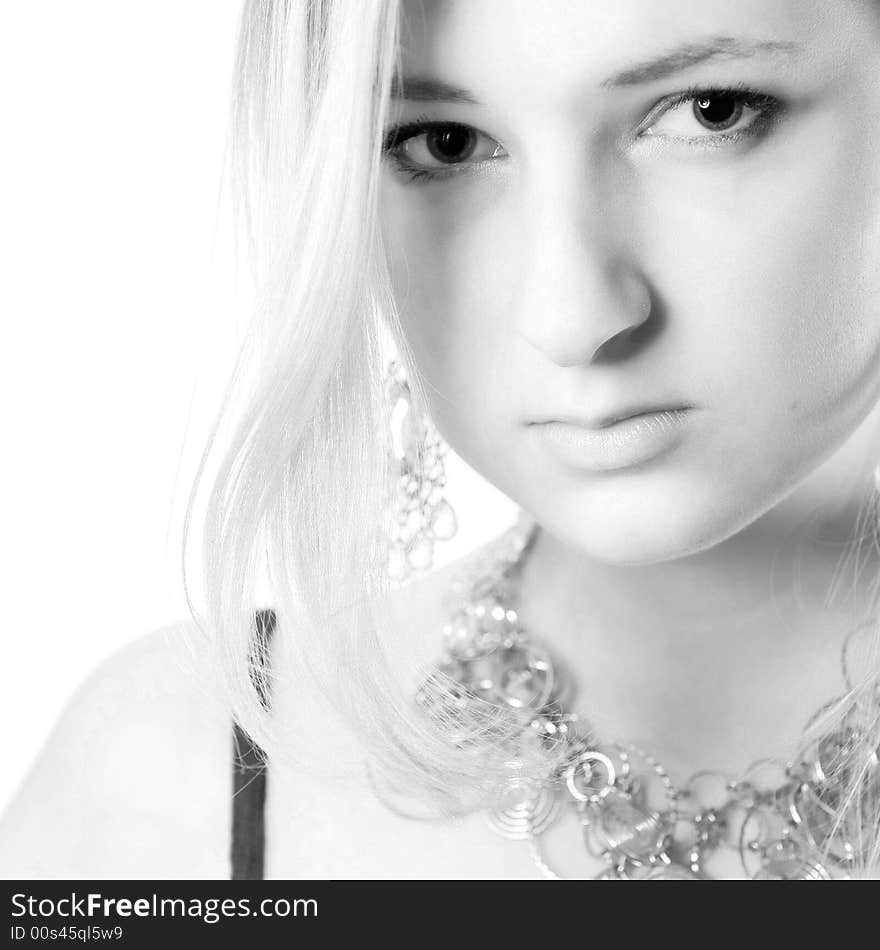 Young girl in a dress in the studio on a white background. Young girl in a dress in the studio on a white background.