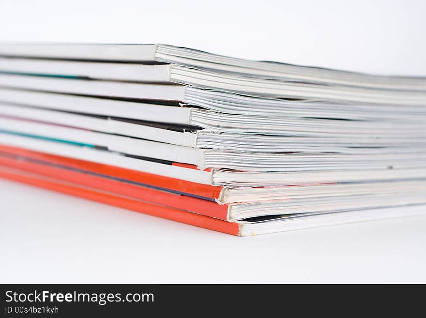 Pile of magazines on a white background