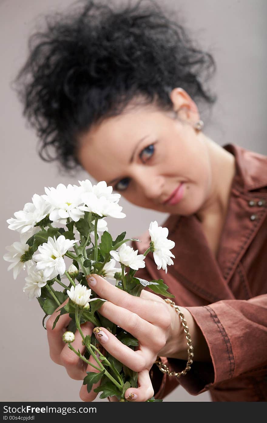 An image of a  beautiful woman with white flowers. An image of a  beautiful woman with white flowers