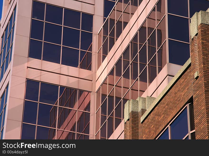 Detail of the glass exterior of a modern office building. Detail of the glass exterior of a modern office building