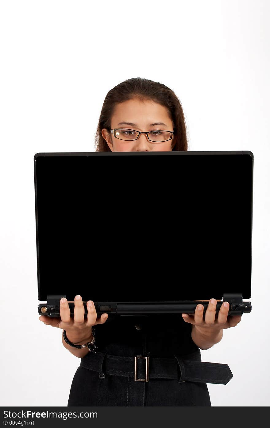 Attractive office girl carrying a black laptop