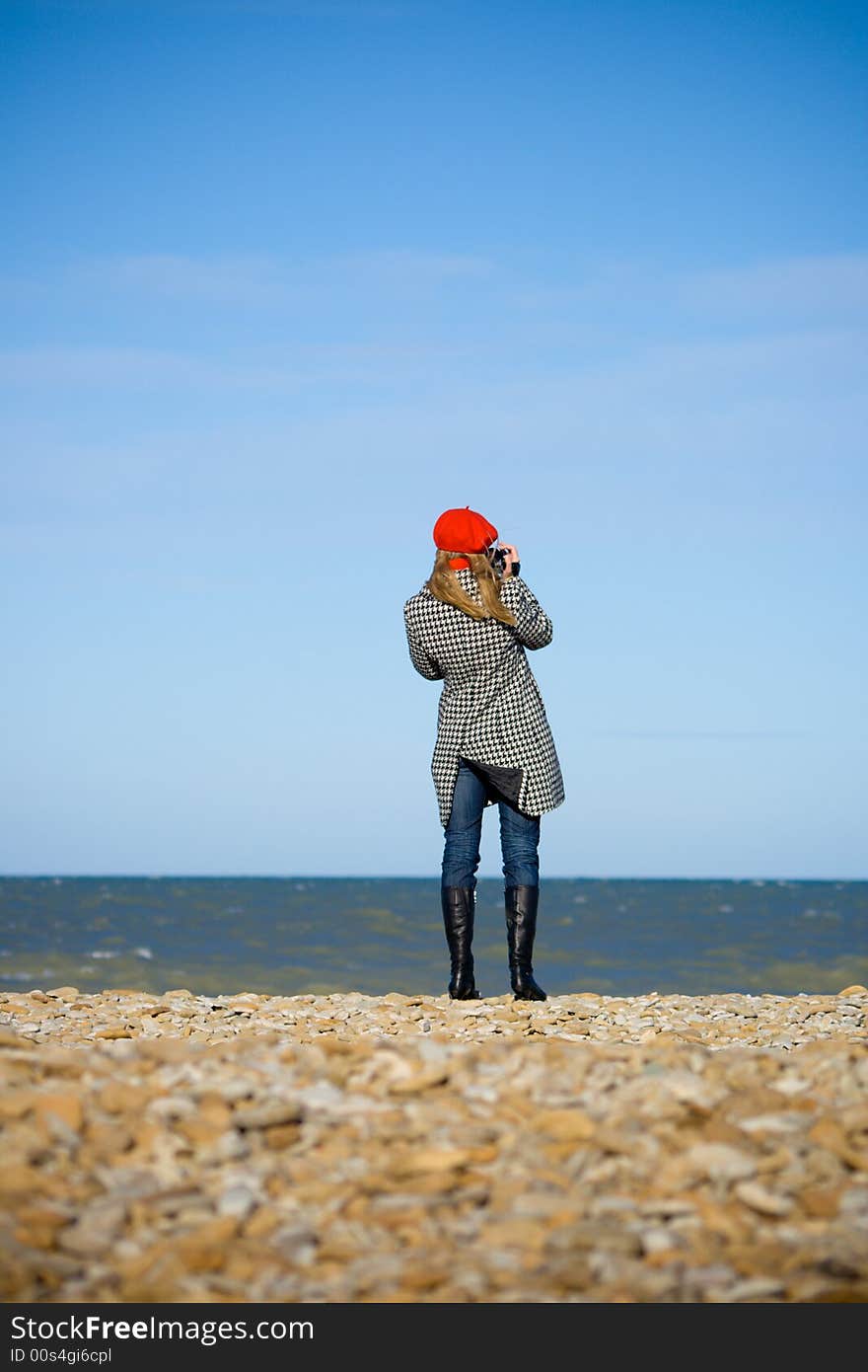 Girl standing on the beach