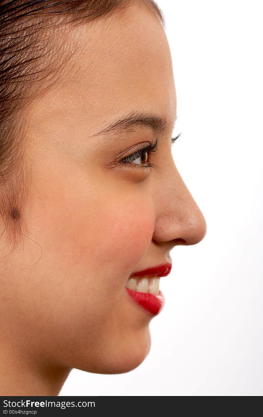 Side view of a cheerful young girl. Side view of a cheerful young girl