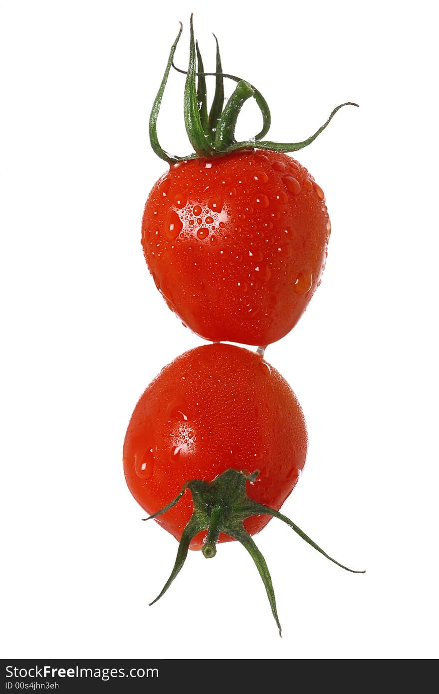 Perfect red tomatoes with drops of water