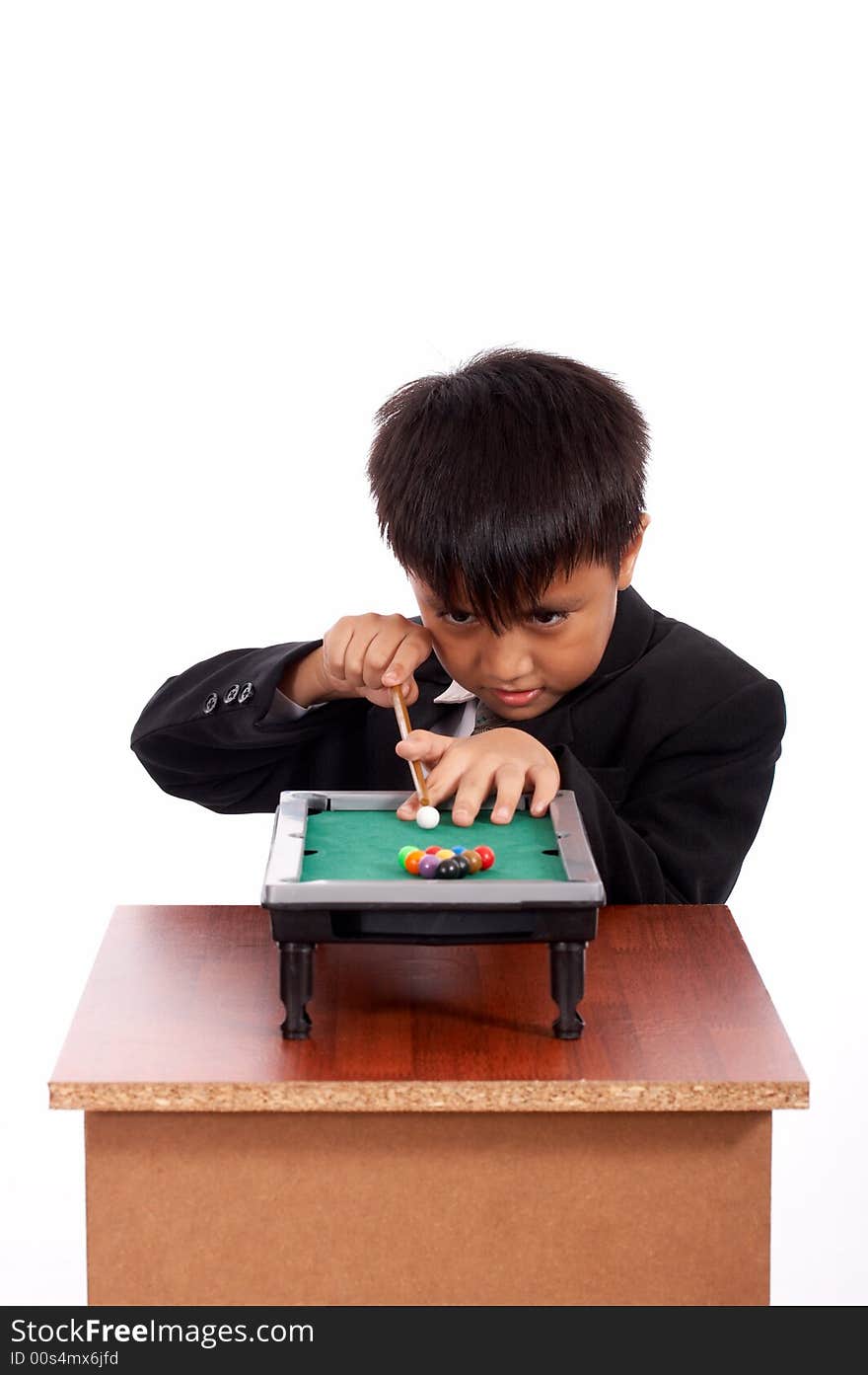 Young man playing billiards in black suit