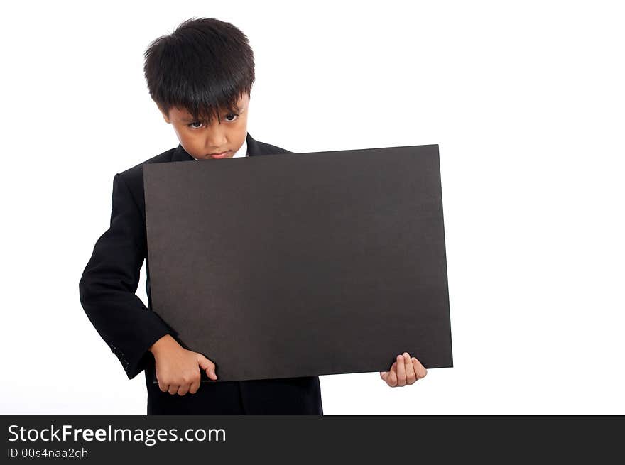 Serious young employee holding a blank blackboard