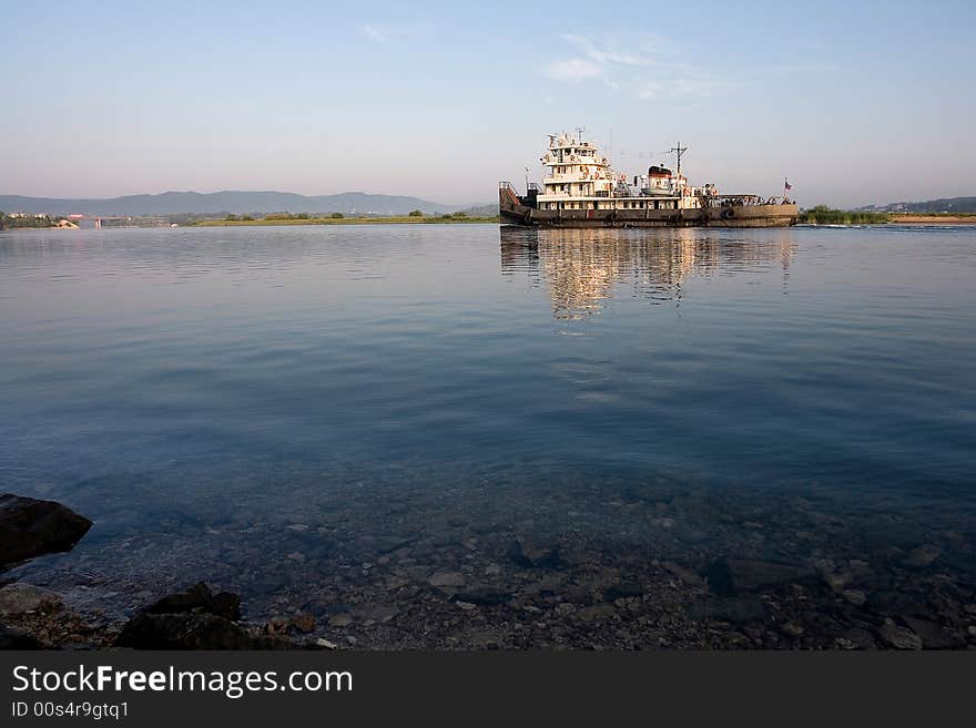 Ship swiming up to the river