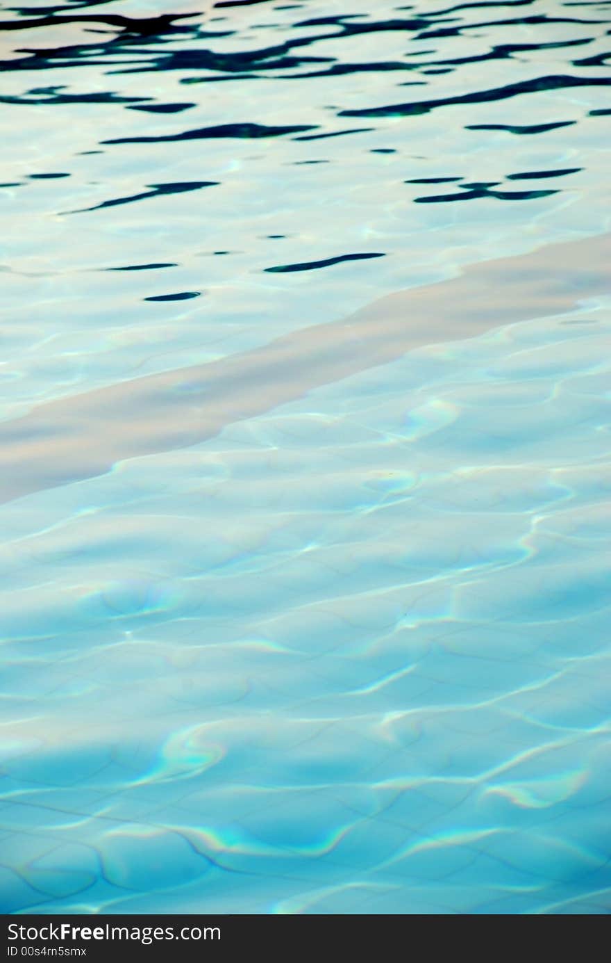 An image of the surface of the water of a swimming pool. An image of the surface of the water of a swimming pool