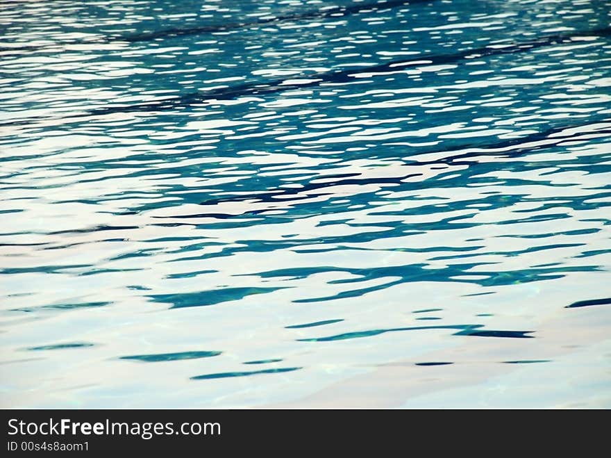 An image of the surface of the water of a swimming pool. An image of the surface of the water of a swimming pool