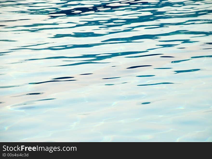 An image of the surface of the water of a swimming pool. An image of the surface of the water of a swimming pool