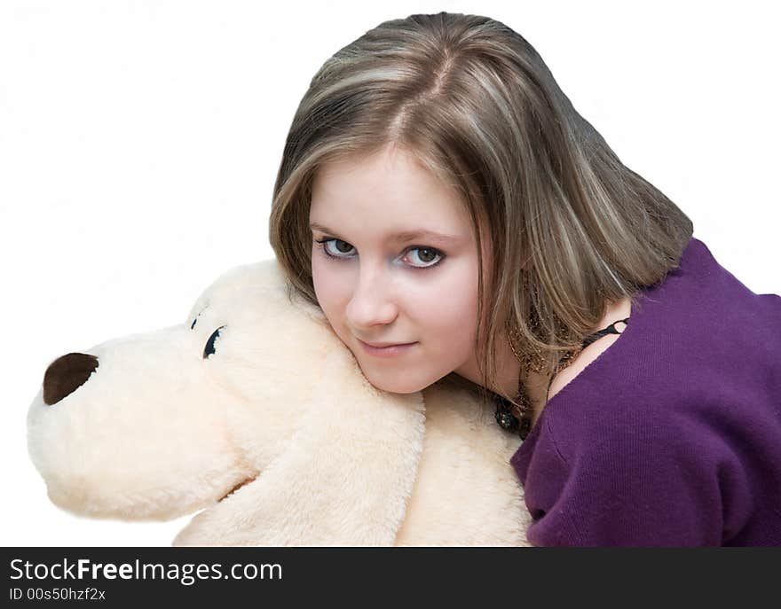 Pretty girl smiles in thought on white background