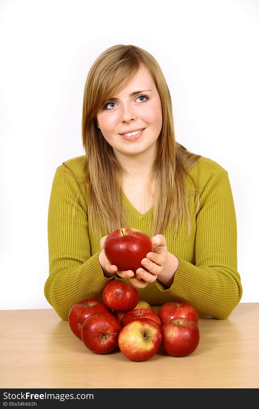 Beautiful young woman holding a apple