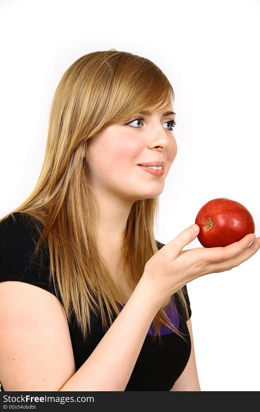 Beautiful young woman holding a apple