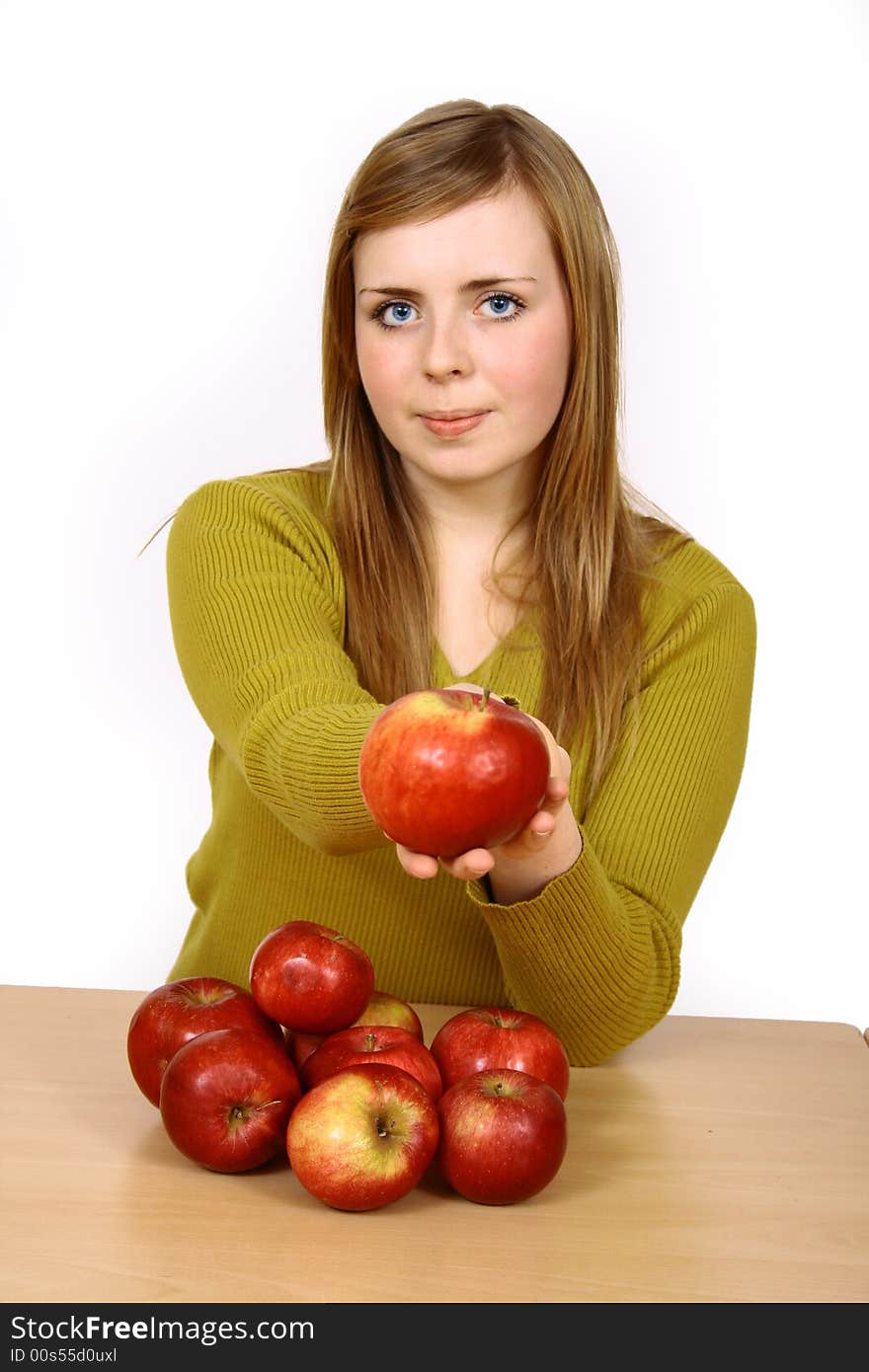 Beautiful young woman holding a apple